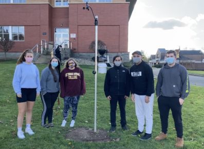 Six Students with weather station in front of Costello Hall