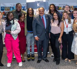 MLK III on campus with students and employees smiling for group photo
