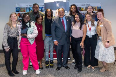 MLK III on campus with students and employees smiling for group photo