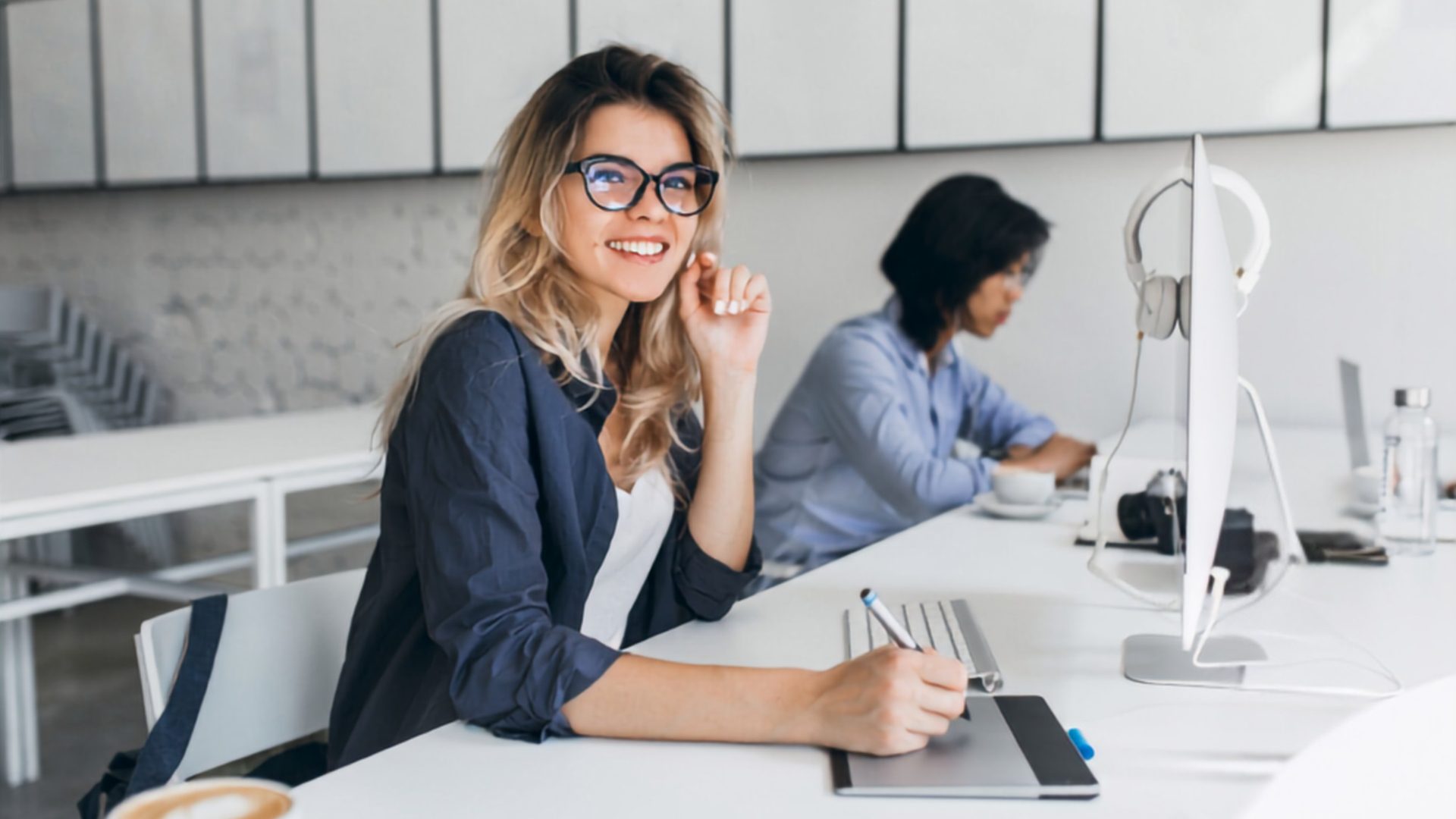 woman at desk working on computer